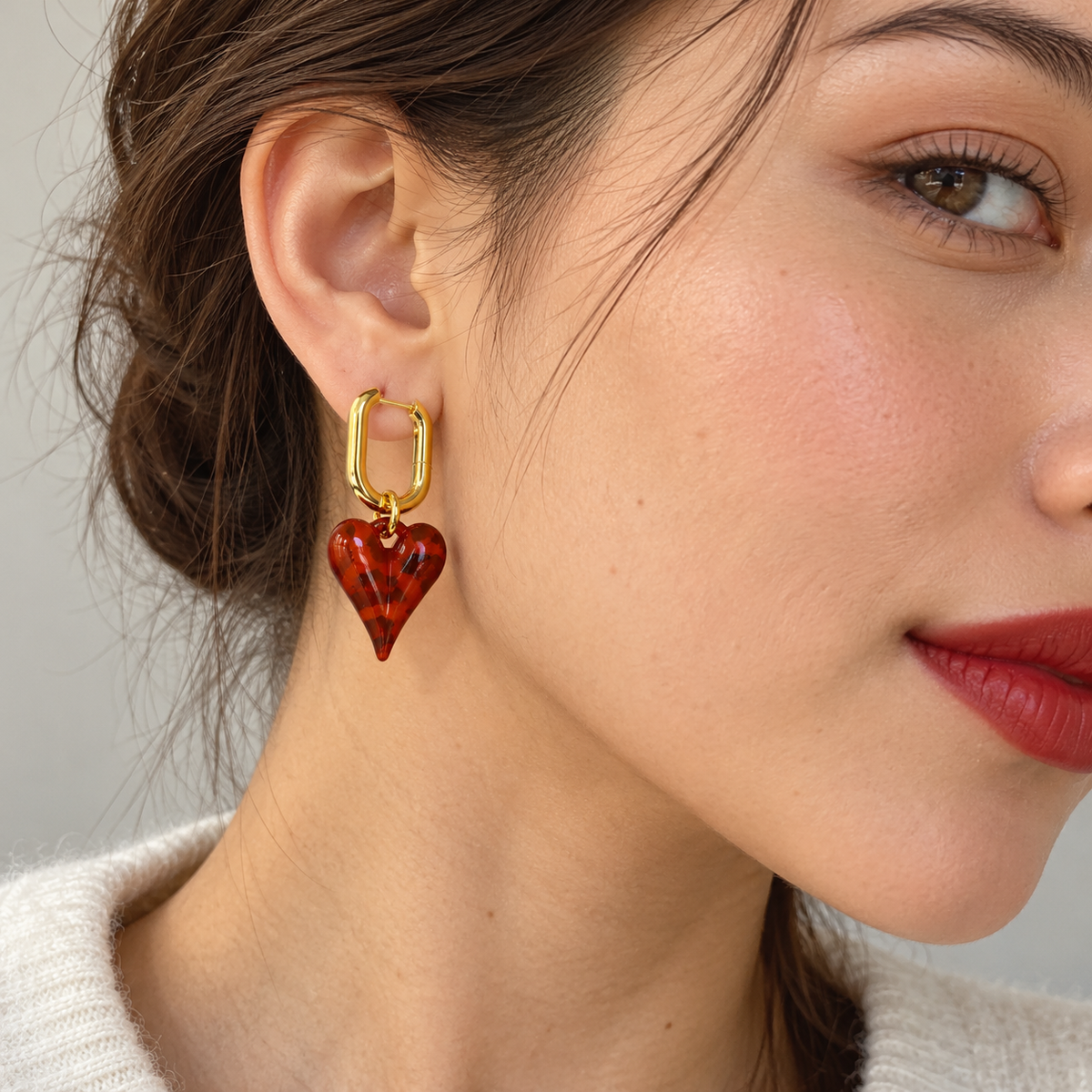Cherry Glaze Heart Hoops worn by a model